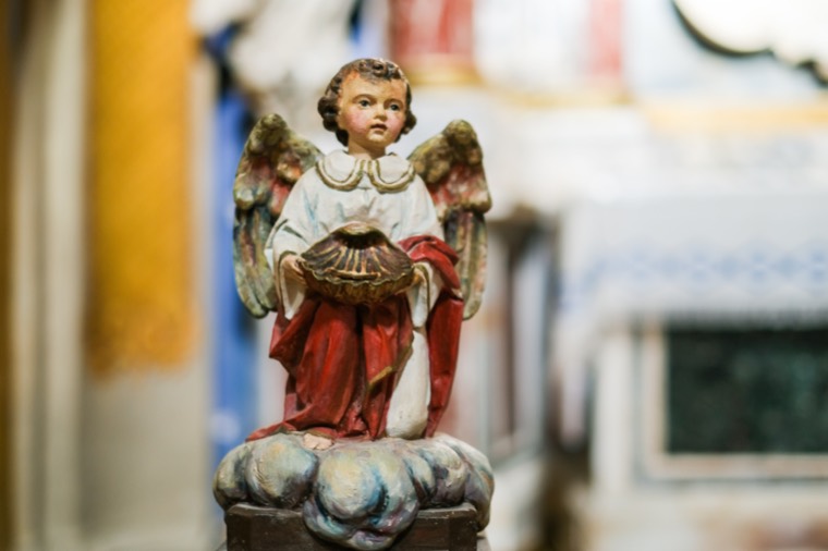 painted wooden angel figurine