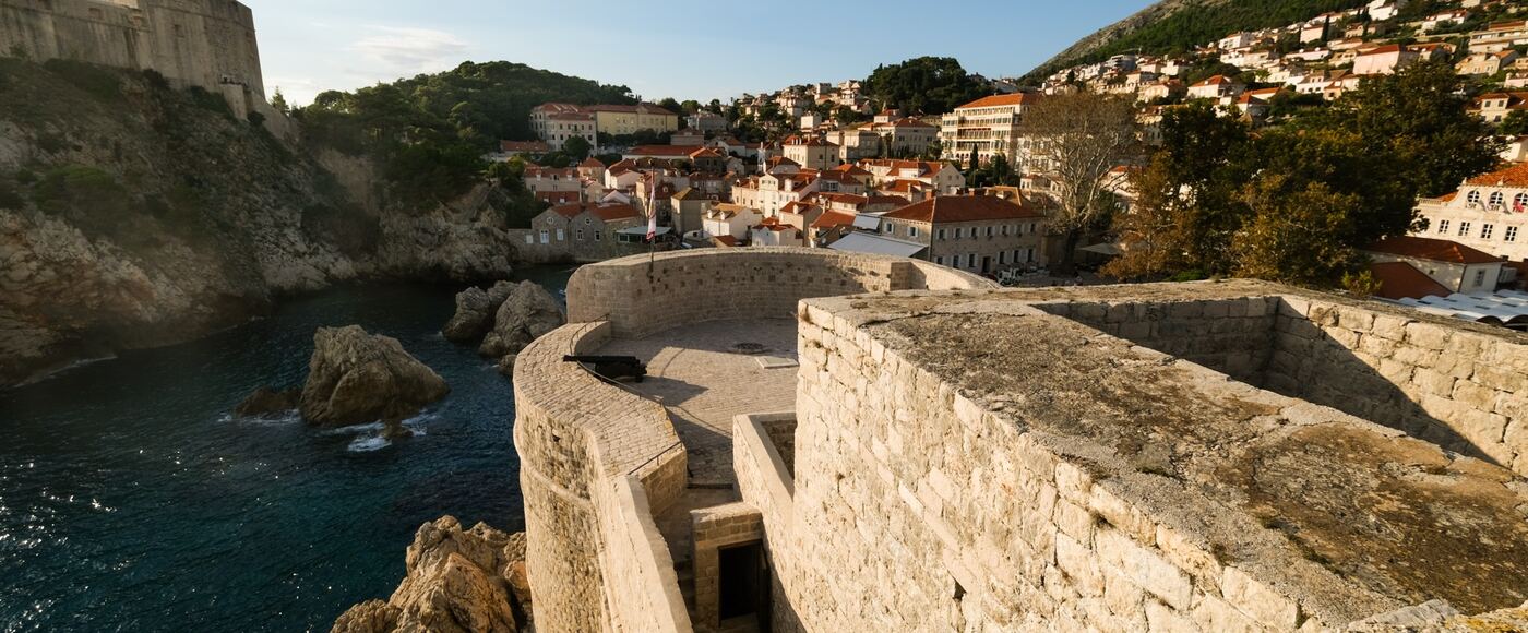 The stone sea walls and red rooftops of the old town of Dubrovnik, Croatia